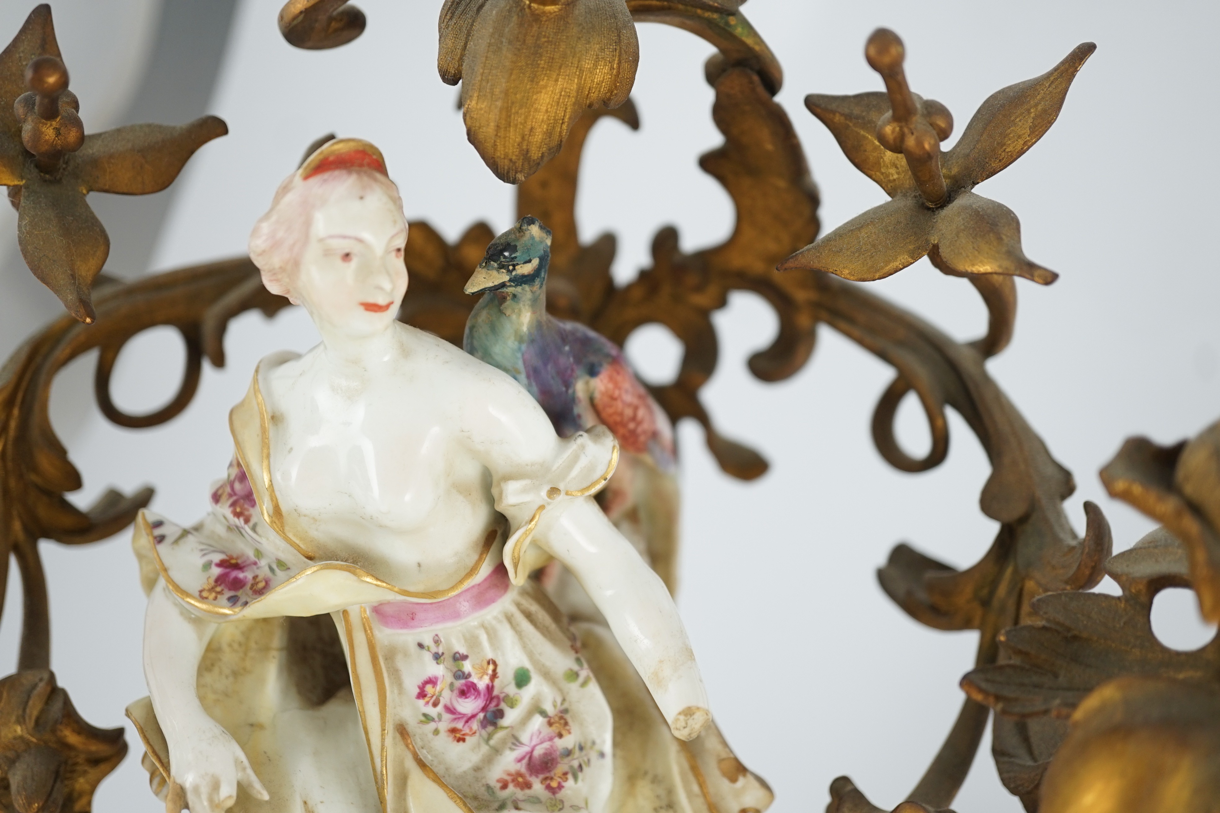 A pair of large Derby porcelain and ormolu mounted ‘Juno and Jupiter’ figural candelabra, the figures c.1760, total height 39 and 41cm, losses and restoration, Provenance - purchased from Winifred Williams, Eastbourne/Lo